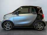 a smart car that is parked in a showroom