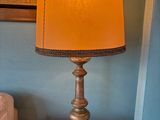 a lamp that is sitting on a table next to a couch