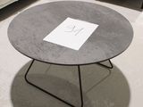 a table that has a sign on it in a room