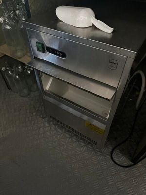 a silver oven sitting on top of a metal counter