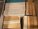 a box full of books that are sitting on the floor