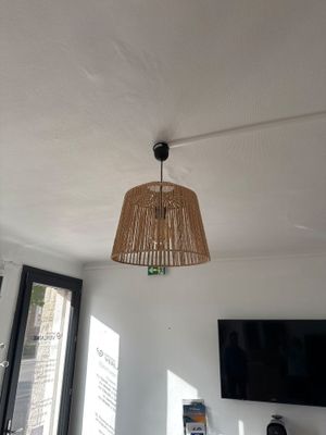 a lamp that is hanging from the ceiling in a room