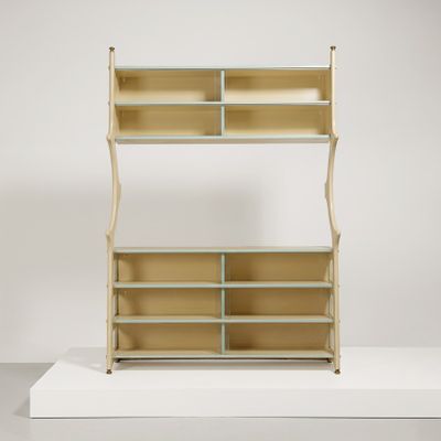 a white shelf with two shelves on top of it on a white surface