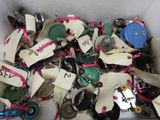a box filled with assorted buttons and tags