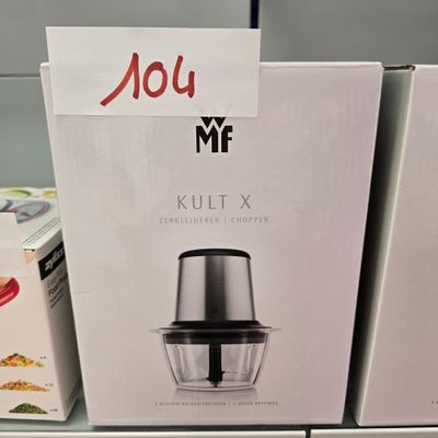two boxes on the shelf of a store with a blender