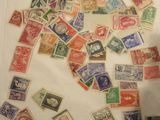 a lot of stamps in a bag on the table