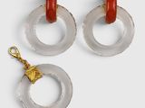 two pairs of red and clear acrylic hoop earrings with gold accents