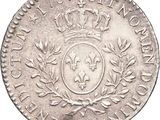 a close up of a coin with a crown on top of it