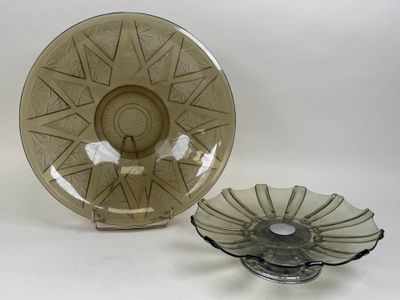 a glass bowl and a glass plate on a table