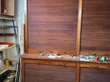 a large wooden cabinet in the middle of a room