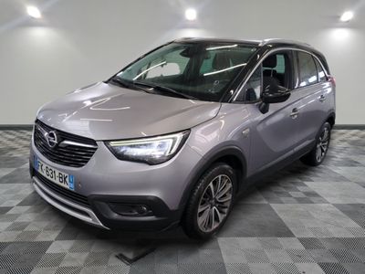the grey opel is parked on a checkered tile floor