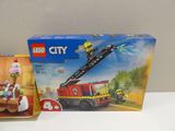 a box of lego city firetrucks and a box of ice cream