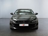 the front view of a black car in a white room