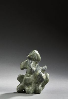 an image of a statue of a man sitting on top of a rock