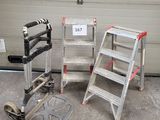 two ladders sitting next to each other in front of a garage door