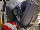 a pile of luggage and skis sitting in a garage