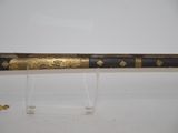 an image of a sword with a gold decoration on it