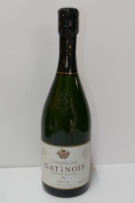 the bottle of wine is sitting on the table ready to be filled