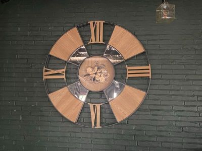 a clock on the wall of a building with roman numerals on it