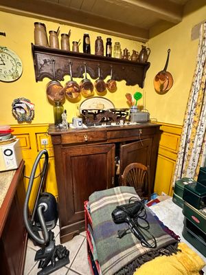 a kitchen with a stove, oven, sink, and other items on the wall