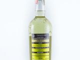 a bottle of alcohol sitting on top of a white surface