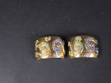 a pair of gold and blue enamel earrings