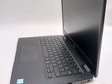 a laptop that is sitting on a white table
