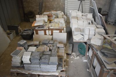 a lot of boxes and boxes of marble on a pallet