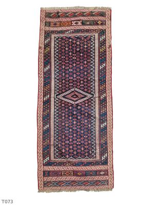 a red and blue rug with a diamond design on it