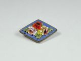 a small plate with flowers on it sitting on a table