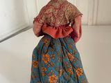 a figurine of a woman in a blue dress