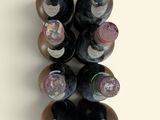 many bottles of wine that are stacked on top of each other