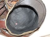 a close up of a pair of shoes and a hat