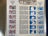 a blue book with a page of stamps on it