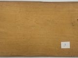 an image of a piece of wood with a tag on it