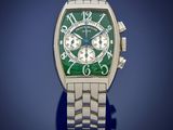 a close up of a watch with a green face on a blue background