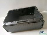 a plastic box with a hole in it on a table