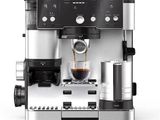 a close up of a coffee machine on a white surface