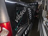 a van that is parked inside of a building