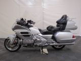 a silver motorcycle that is parked in a room