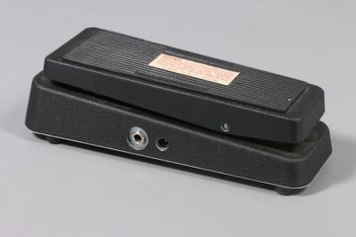 the pedal pedal pedal is sitting on top of a gray surface