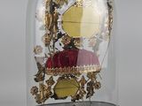 a glass dome with a clock inside of it