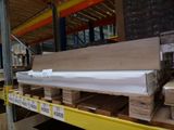 a lot of wooden planks on a pallet in a warehouse