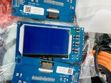 two electronic devices that are sitting on a table