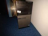 a dell desktop computer sitting on the floor in a room