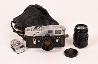 a black and white photo of a camera and some other things