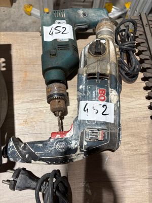 a picture of a drill and other tools on a table