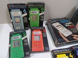 several boxed nintendo games are on display on a white table