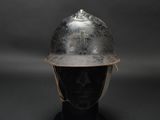 a helmet with a cross on it on a mannequin head