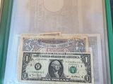 a picture of a one dollar bill in a clear case